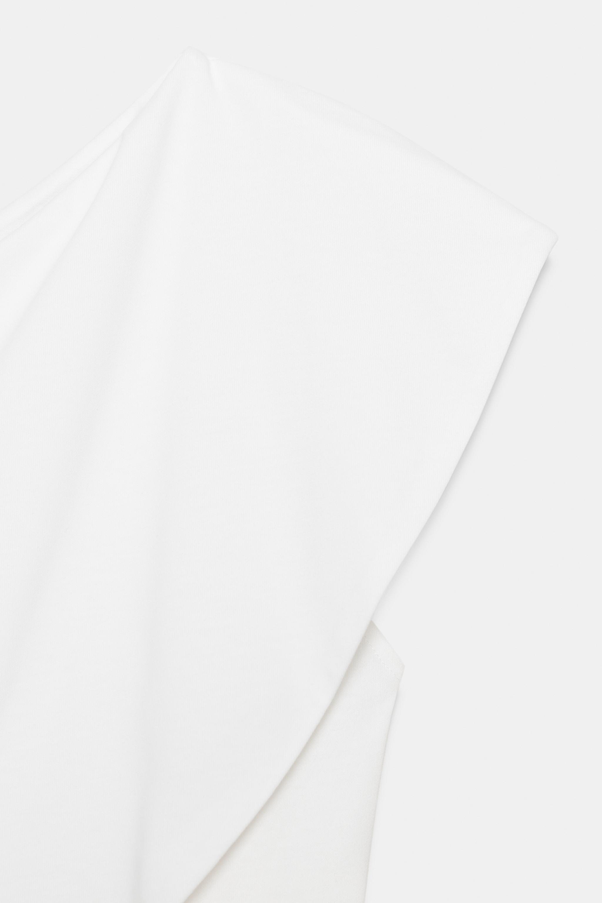 ASYMMETRIC INTERLOCK TOP